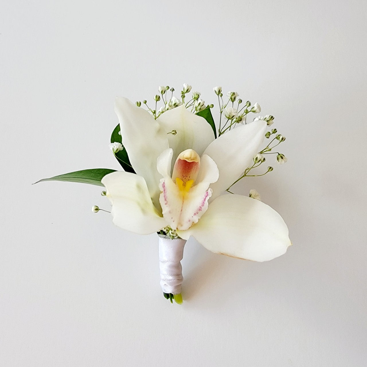 white orchid corsage boutonniere