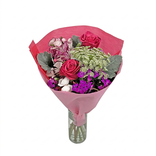 Pink XOXO Farm Bouquet in a vase on a white background