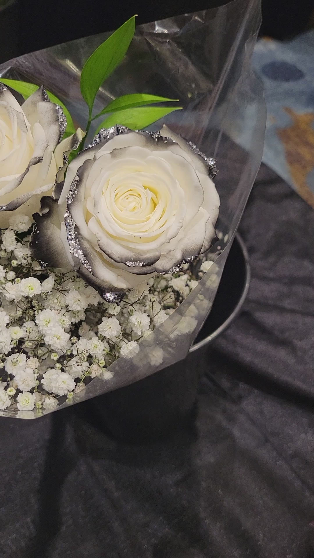 white rose with black tips and silver glitter